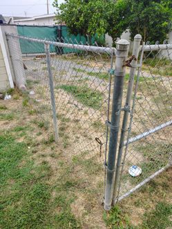 Chain link fence with gate and poles