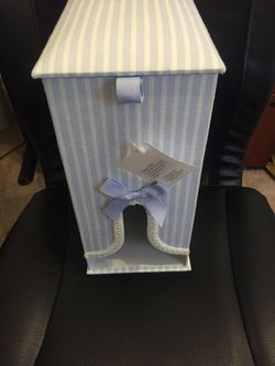Diaper caddy light blue and white striped. Brand new with tags attached.