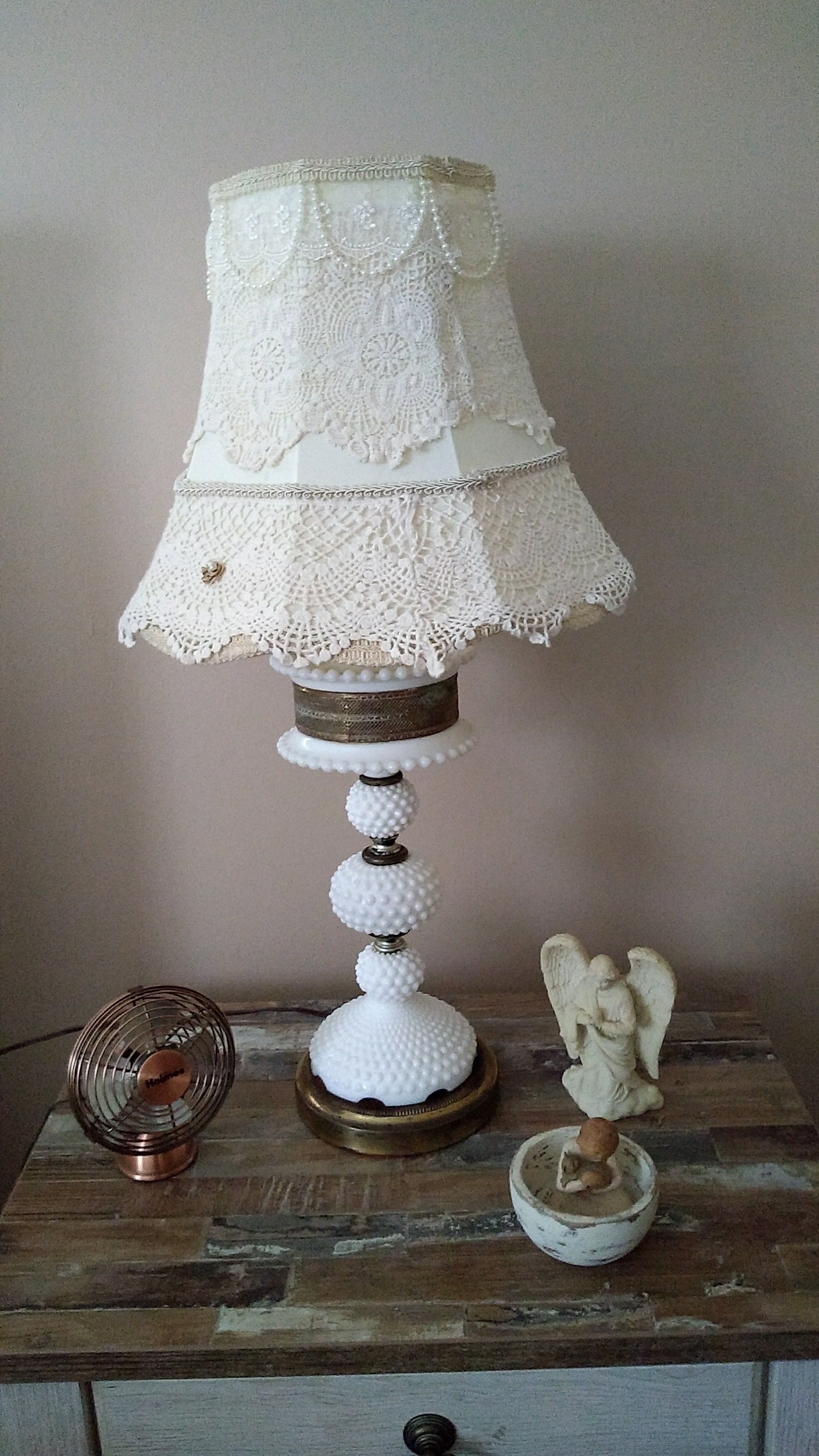 Antique milk glass lamps with custom made shades.