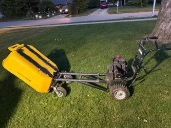 Motorized wheel barrel dump