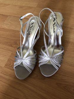 Woman’s dressy silver heels size 9