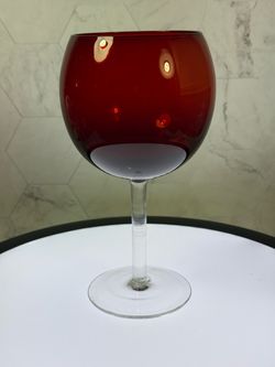 Set of (4) Rare 7” tall water/wine glasses. Ruby red. Manufacturer unknown.