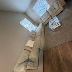 Complete living room set. Spacious and comfortable sofa. Coffee table and bar stools in good condition.