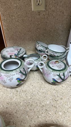 Vintage tea, cups, saucers, creamer, and sugar bowl