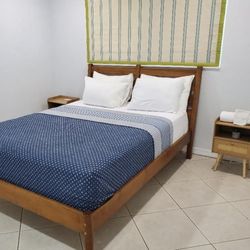 Solid wood queen bed with two night stands