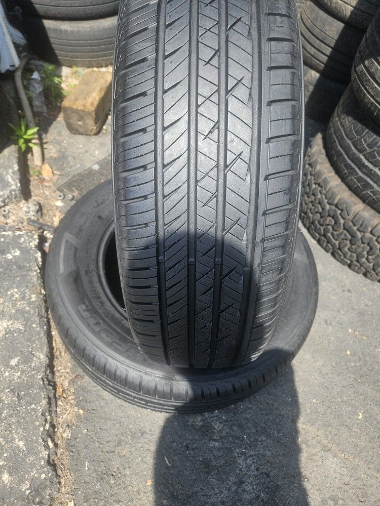A pair of tires with size 235/65/18
