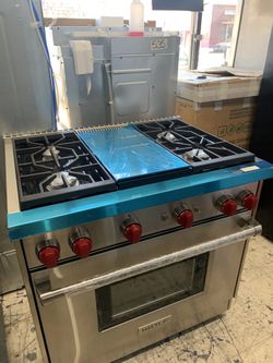 Wolf 36” slide in range with middle grill in stainless steel all gas