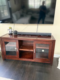 Wood Entertainment Center with glass doors