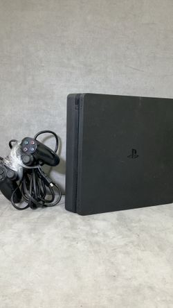PS4 with chords and controller