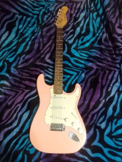 Pink bridgecraft guitar