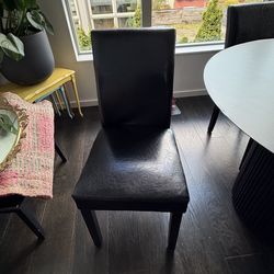 Black faux leather dining chairs