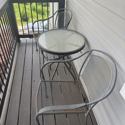 2 Iron Chairs And Glass Table