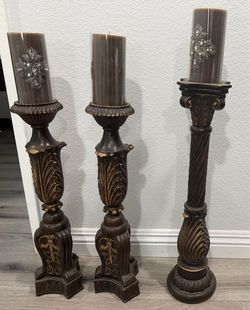 Trio of Tuscan style resin decorative candle holders with candles