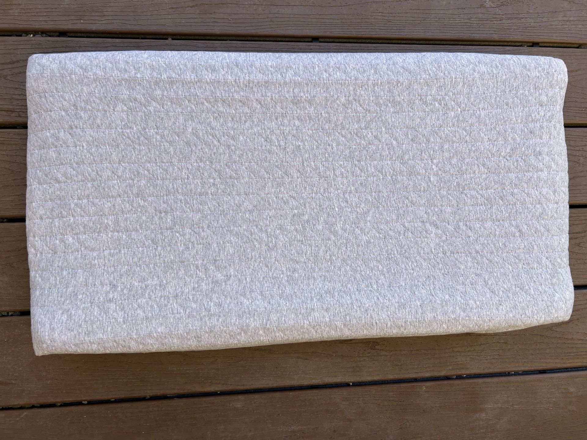 Changing pad with a cover