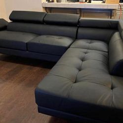New Sectional With Adjustable Headrests.  Black Or White Leather.  106” X 77”.  Free Delivery!