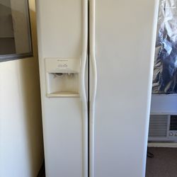 white Frigidaire side-by-side fridge with water/ice dispenser