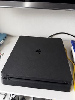 Sony PS4 Slim console & plug (no other accessories)