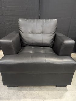 Contemporary Black Armchair with Tufted Cushions