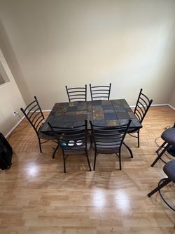Ashley Furniture Antigo dining table and 6 chairs / Ashely Slate dining room table