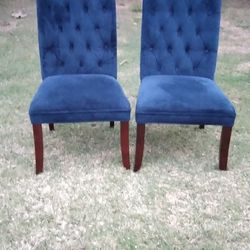 2 blue velvet chairs