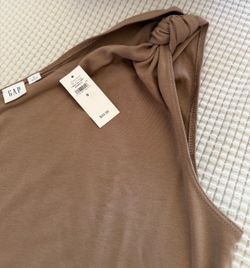 This Gap dress features a brown, one-shoulder design with an asymmetrical neckline. [1] * Brand: Gap *  * Style: One-shoulder ribbed mini dress *  * C