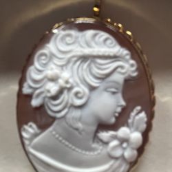 Beautifully Detailed Giovanni APA Cameo On Chocolate Colored Conch. Braided Head Band Along With Beaded Necklace Among Other Intricate Details. 