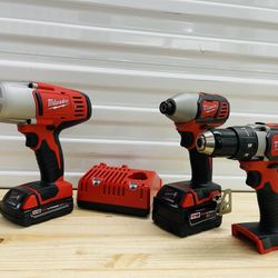 Milwaukee m18 1/2” impact wrench, impact driver, drill with 2ah, 5ah battery and a charger