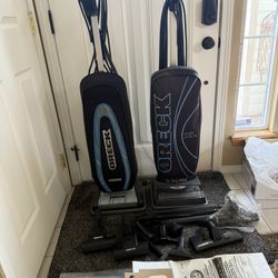Two Oreo Upright Vacuum Cleaners With Attachments And Bags. 
