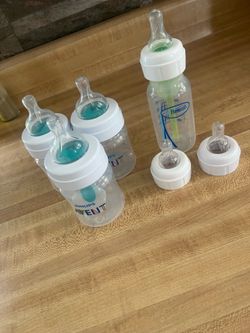 Three 4oz Avent Bottles and one Dr Brown 4oz Bottle