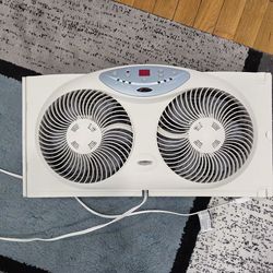 Window Fan with Reversible Airflow Blades