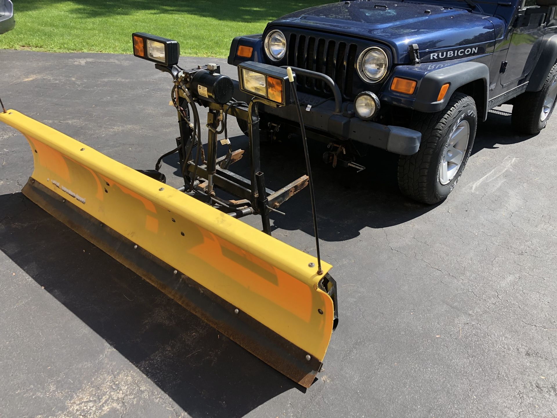 Fisher homesteader plow. Works great off 2004 jeep wrangler