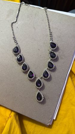 Purple glass necklace.