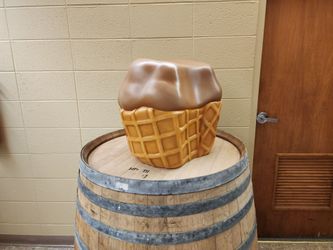 A TivoliToo Chocolate Ice Cream Scoop Sculpture Stool