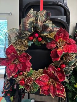 Hand decorated pinecone wreath for Christmas
