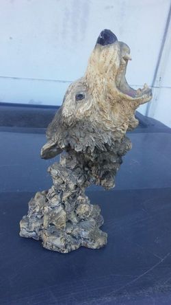 Open. Mouthed wolf statue - negotiable