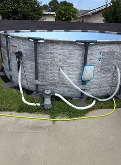 Above ground pool with pump