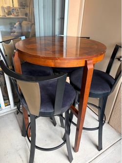Bar top table and swivel chairs set