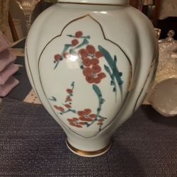 11inches Tall Very Unique And Beautiful LOOKING VASE  This HAS LOTS OF GOLD TRIM 