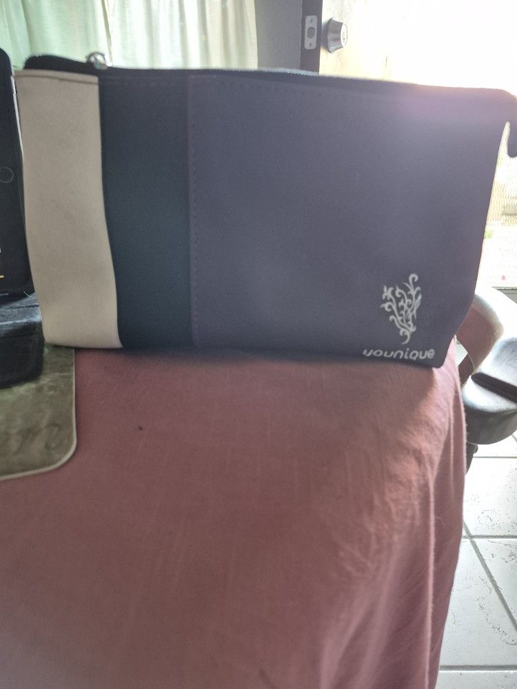 YOU NIQUE WALLET BAG OR MAKEUP EXCELLENT CONDITION ORIGINAL PRICE $75.
