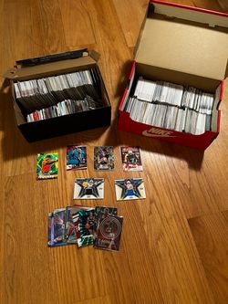 Over 300 sports cards: football basketball baseball and more included are 2 numbered cards and 2 patch cards