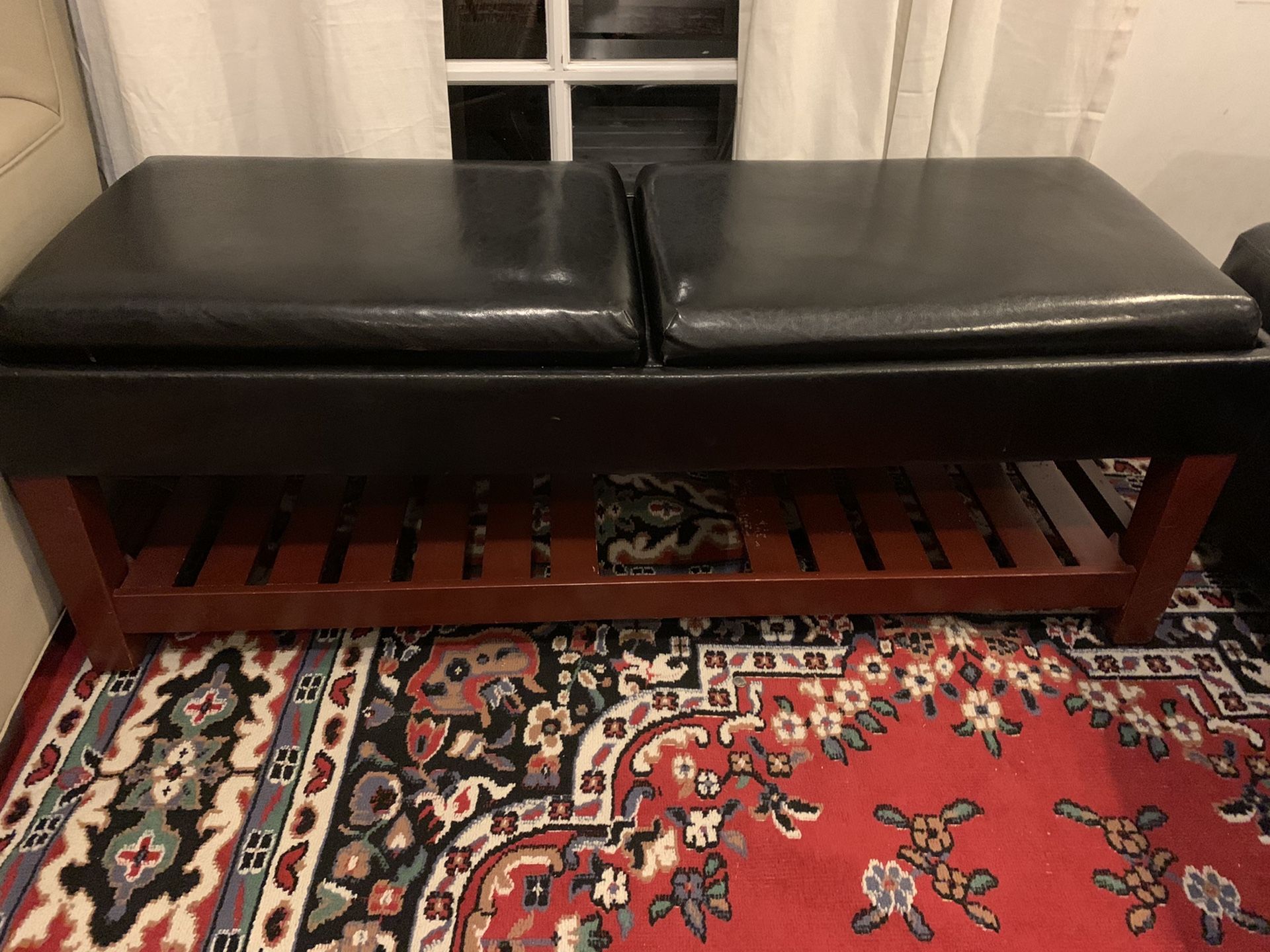 Faux leather convertible bench/ coffee table. Top can be converted to trays.