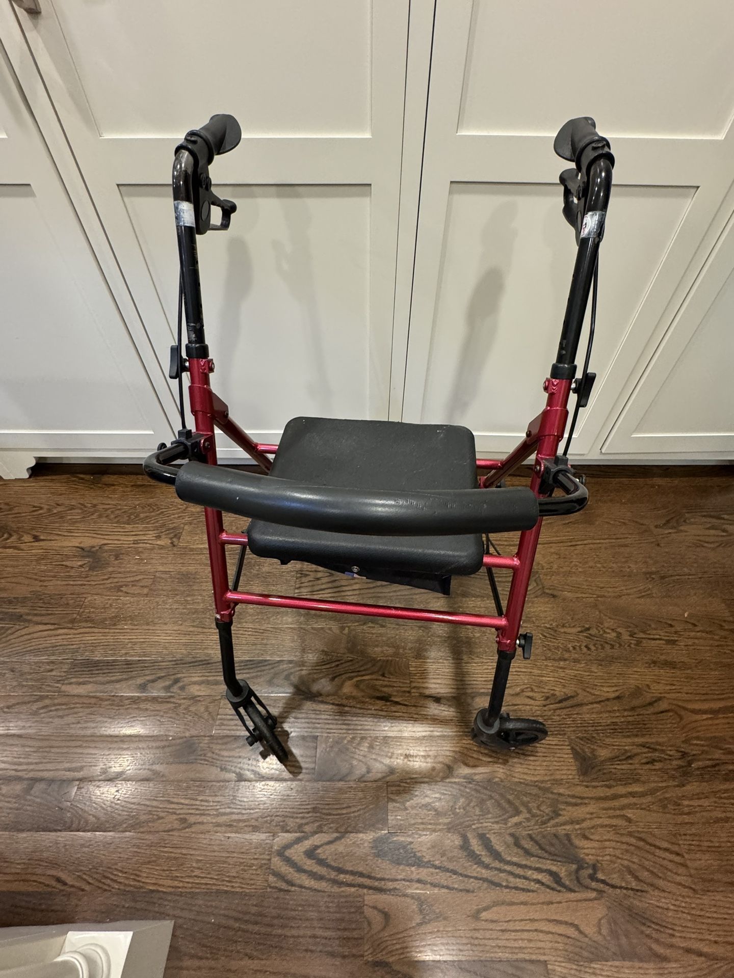 Walker with seat and compartment