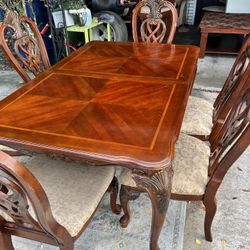 Antique 6 Chair Dinning Set With China cabinet Table is 5.5 feet and with leaf  + 19 inches 42 inches wide Cabinet is 78 inches high by 49 inches  by 