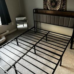 Queen size bed frame with cushioned head board and shelf 