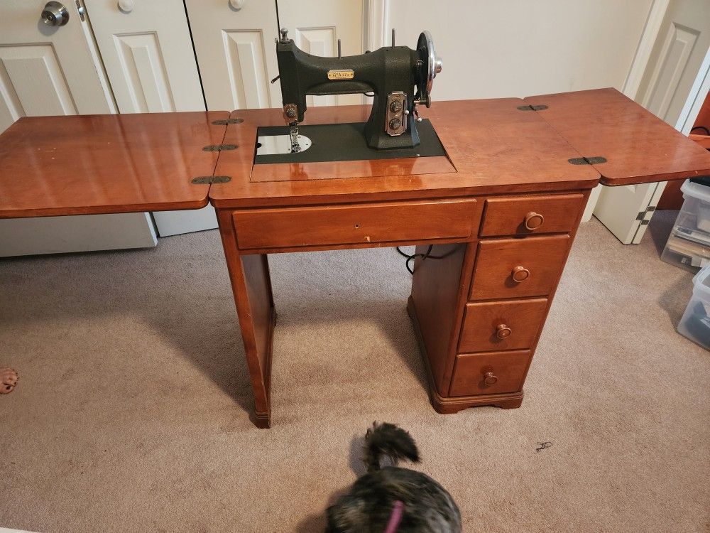 White Sewing Machine In Desk.