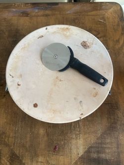 Pizza stone with holder and pizza cutter