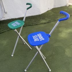 Set of 2 Sport Seat folding golf spectator chairs – one blue and one green.