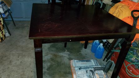 Table with 4 chairs got some damage on top from heat