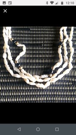 Pearl necklace with black and gold beads