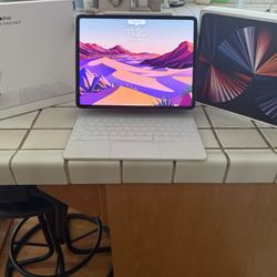 iPad Pro + Apple Watch Ultra 2